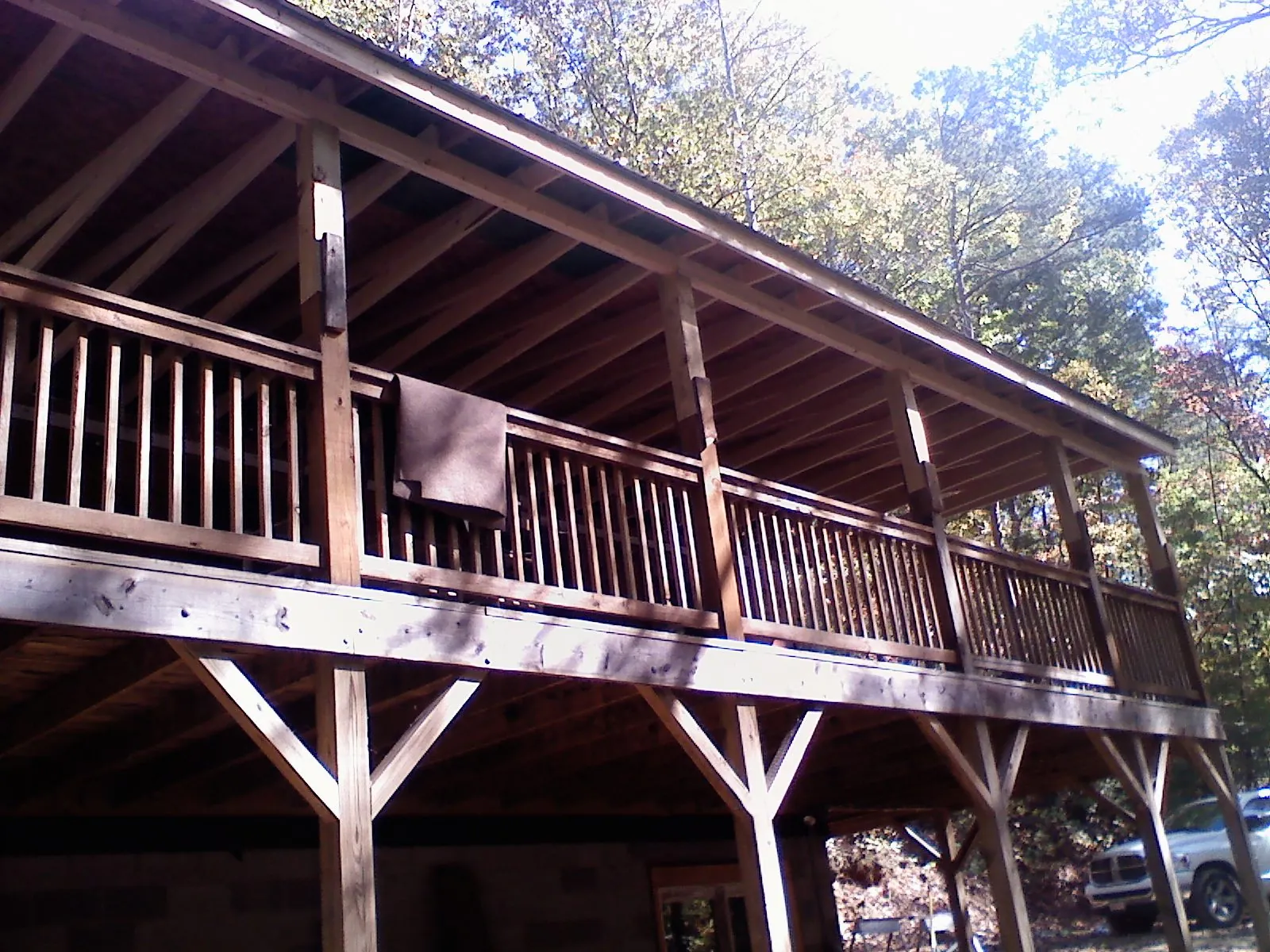 Timber framing under a new elevated porch and deck — Roof Leak Repair in North Weymouth by Roofing Brothers
